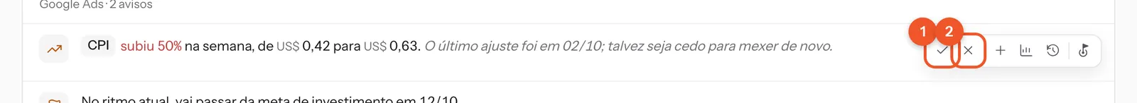 A barra de ícones de um aviso: o visto é o botão Concluído e o X é o botão Descartar.